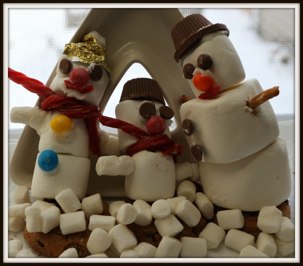 This snowman family was a messy bunch of fun. Gluing candy buttons with icing. This is some ugly fun!