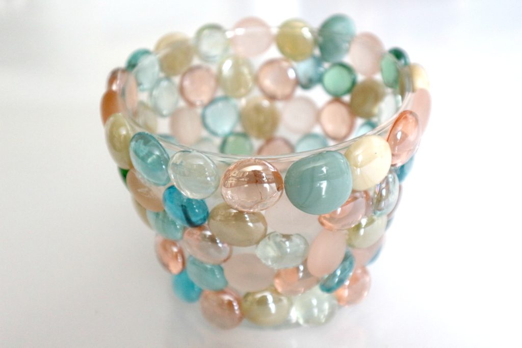 This beautiful vase was made with a bag of turquoise glass gems or flat sided marbles and hot glue. It turned out beautifully. mybrightideasblog.com