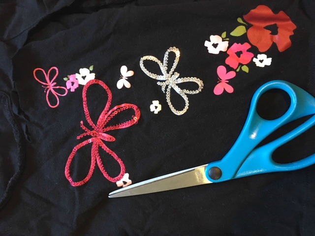 Cut up your favorite baby clothes and sew it as an applique onto a plain top. Easy project! mybrightideasblog.com