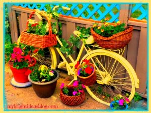 Yellow Painted Bike Planter. So easy with an old bike and a few plants, this creates a seriously fun conversation piece! mybrightideasblog.com