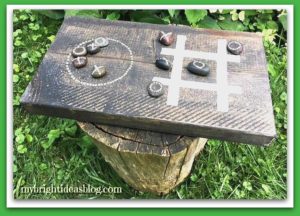Make a Tic Tac Toe Board Game! A scrap of wood and ten stones and you have a super easy wood project! mybrightideasblog.com