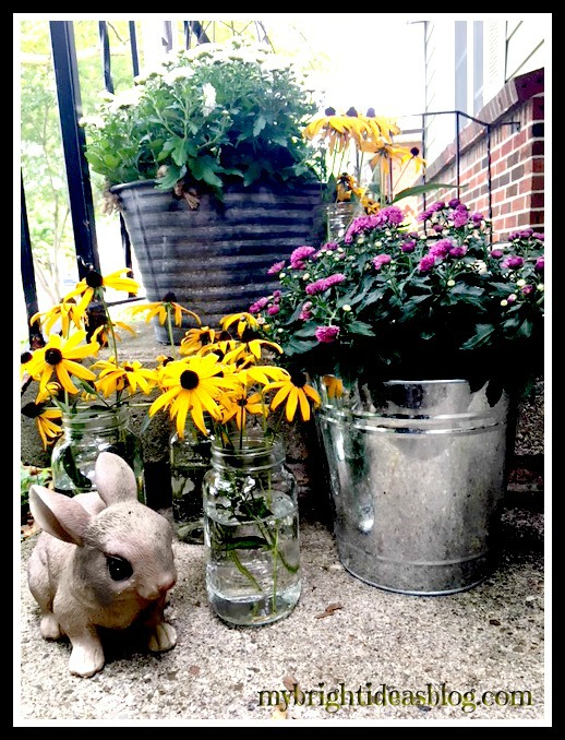 Use Mason Jars for Fall Decor. Decorate your porch or deck with black eyed susan's in mason jars. Adds lots of color! mybrightideasblog.com